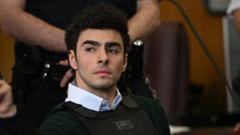 Luigi Mangione Returns to Court With Trial a Month Out, Defense Still Silent