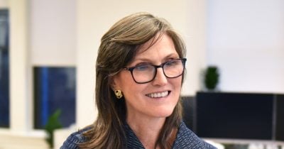 AI Token Price Drop Could Speed Up Adoption, Cathie Wood Says
