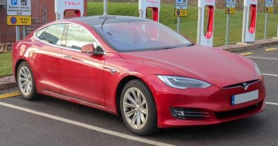 Tesla Reports First Annual Revenue Drop as Musk Pours $25B Into AI and Robots